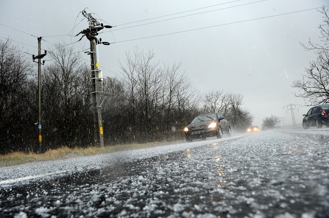 Hailstorm on the road in a summer day